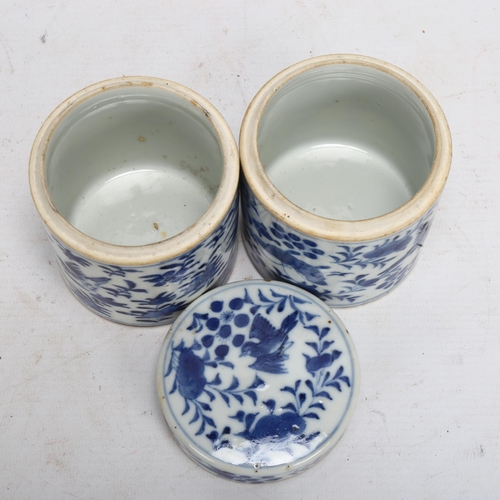 133 - A pair of Chinese blue and white porcelain cylindrical pots, with painted birds (1 lid missing), hei... 