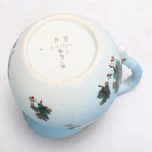 134 - A Japanese porcelain jug with painted cranes, signed under base, height 13cm