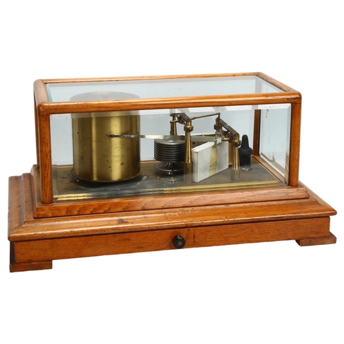 148 - NEGRETTI & ZAMBRA - an oak-cased barograph with bevel-glass panels, length 42cm