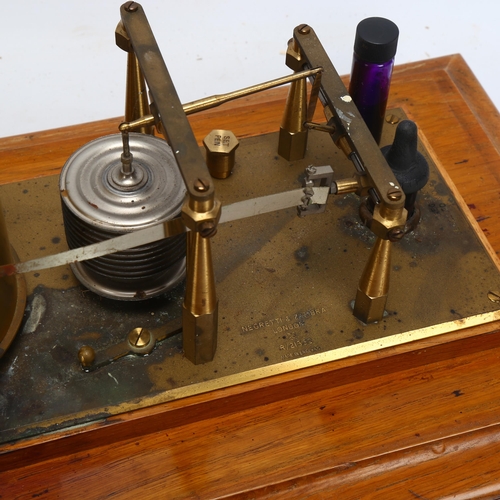 148 - NEGRETTI & ZAMBRA - an oak-cased barograph with bevel-glass panels, length 42cm