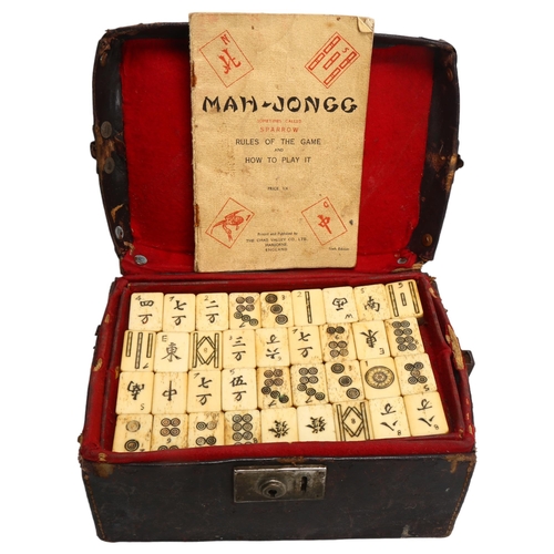 157 - A Chinese Mahjong set, bone and bamboo, in original leather case