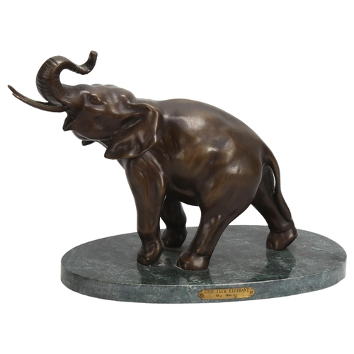 163 - A patinated bronze elephant sculpture, on green marble base, base length 27cm