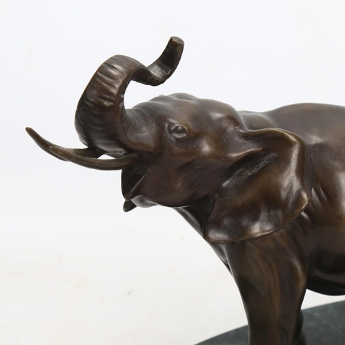 163 - A patinated bronze elephant sculpture, on green marble base, base length 27cm