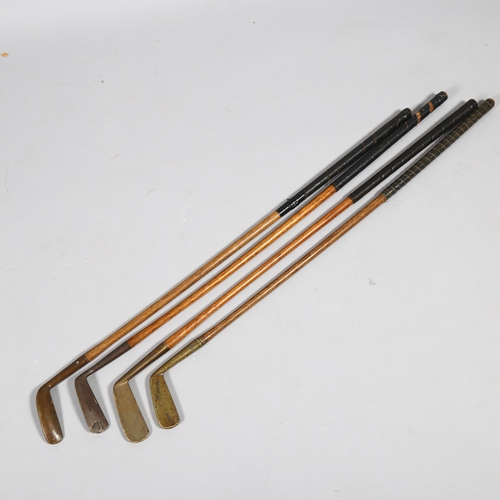 188 - 4 Antique wood-shafted brass golf putters