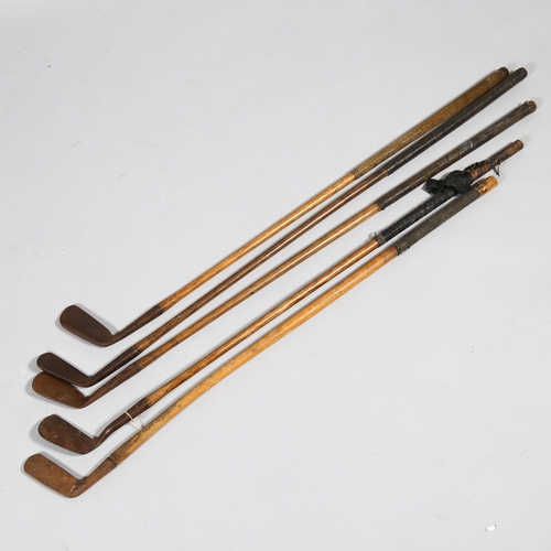 190 - A group of 5 wood-shafted golf wedges