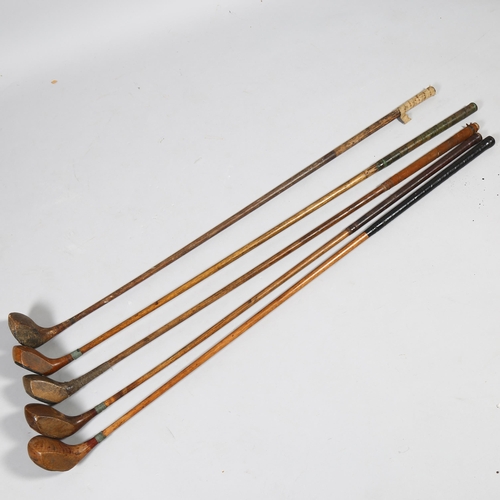 191 - A group of 5 wood-shafted golf drivers