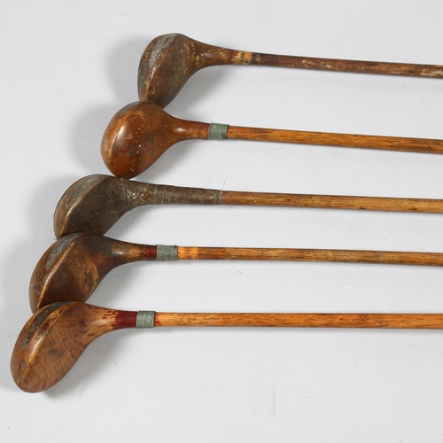 191 - A group of 5 wood-shafted golf drivers