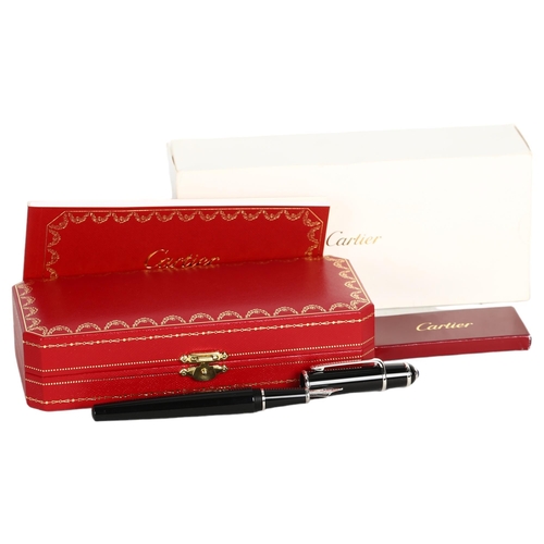 195 - A Cartier black/steel-cased fountain pen, spare ink filler, original case and box, perfect condition