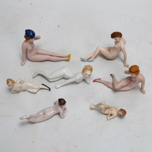 200 - A group of bisque and glazed porcelain nude bathing dolls, circa 1920, largest length 9.5cm (7)