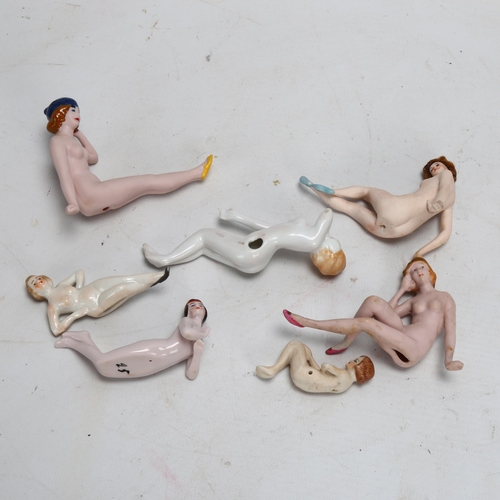 200 - A group of bisque and glazed porcelain nude bathing dolls, circa 1920, largest length 9.5cm (7)