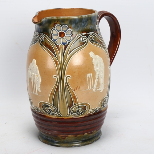 33 - CRICKET INTEREST. A Doulton cricket jug, height 24cm, stamped 164 Doulton, Lambeth, England to base