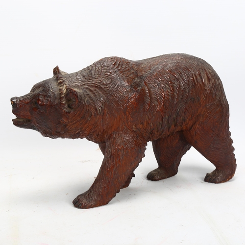 45 - 19th century Black Forest carved and stained wood bear, length 32cm