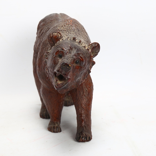 45 - 19th century Black Forest carved and stained wood bear, length 32cm