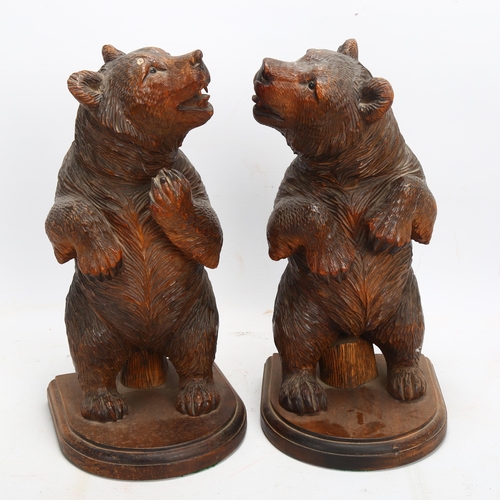 46 - A pair of 19th century Black Forest carved and stained wood standing bears, height 30cm