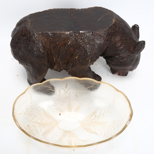 48 - 19th century Black Forest carved and stained wood bear supporting a cut-glass bowl, length 30cm