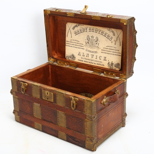 55 - A miniature brass-bound stained wood dome-top novelty box, in the form of a travelling trunk, length... 