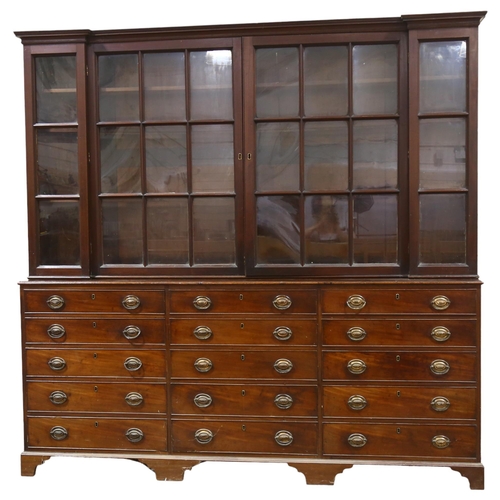 65 - A 19th century mahogany library bookcase, with 4 lattice-glazed cabinets above, and 15 drawers below... 