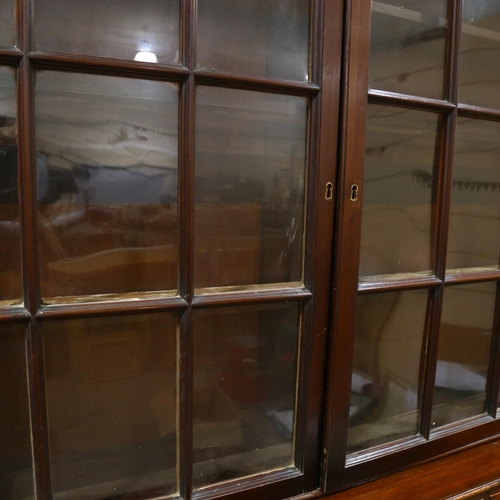 65 - A 19th century mahogany library bookcase, with 4 lattice-glazed cabinets above, and 15 drawers below... 