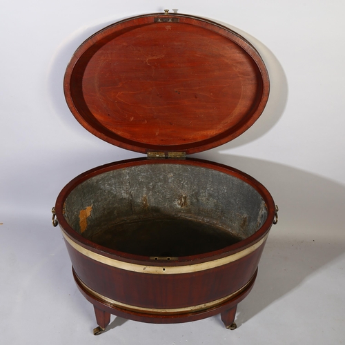 229 - A George IV mahogany oval wine cooler with brass banding and fittings on stand, height 57cm, width 7... 