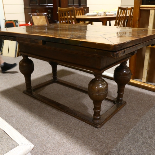 233 - An 18th century oak, extending, refectory table with two drawer leaves on baluster legs on box frame... 