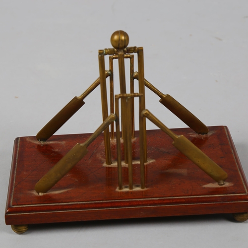 37 - A late 19th century cricket themed letter stand, brass stumps and bats on mahogany base with brass c... 