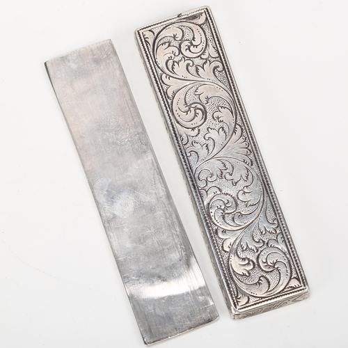 1433 - A 17th/18th century English silver domino box, with sliding lid and allover engraved foliate decorat... 