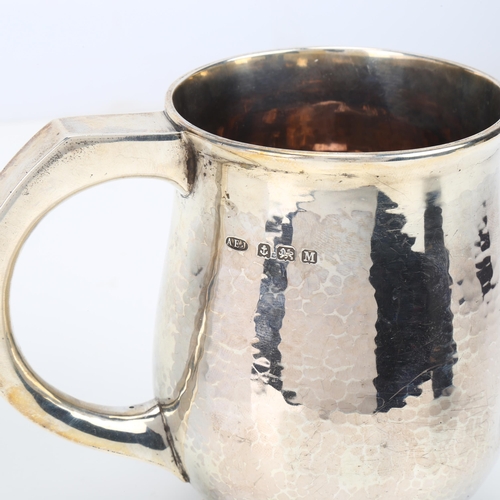 1436 - An Edward VIII silver pint mug, Albert Edward Jones, Birmingham 1936, baluster form with planished d... 