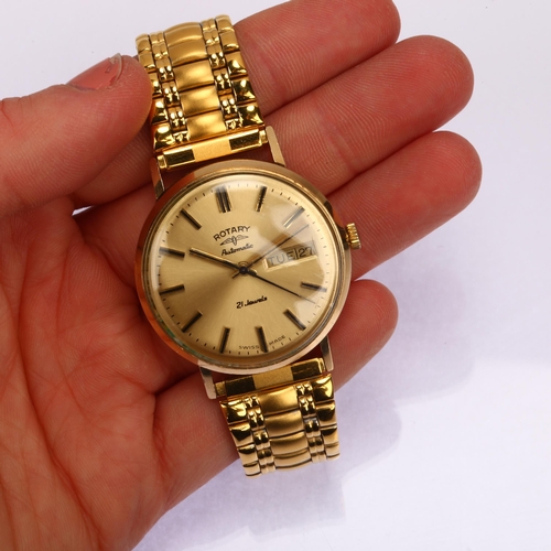 1006 - ROTARY - a 9ct gold automatic calendar bracelet watch, champagne dial with applied baton hour marker... 