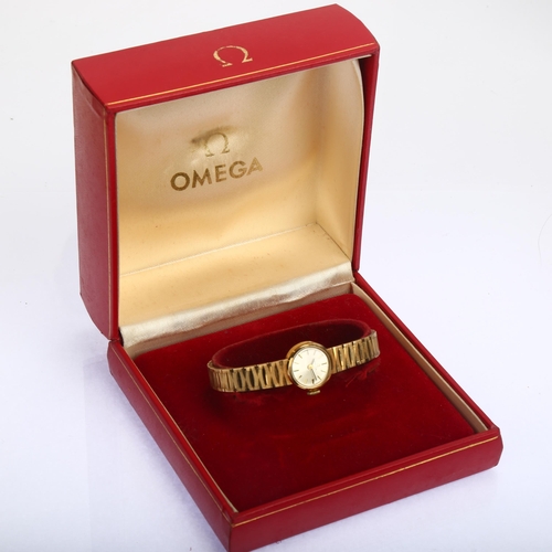 1027 - OMEGA - a lady's 9ct gold mechanical bracelet watch, circa 1966, silvered dial with applied gilt bat... 