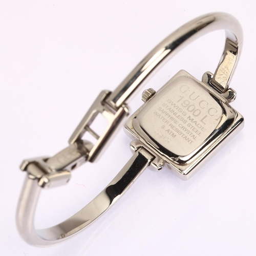 1029 - GUCCI - a lady's stainless steel 19L quartz bangle watch, circa 2000, square silvered dial with leaf... 