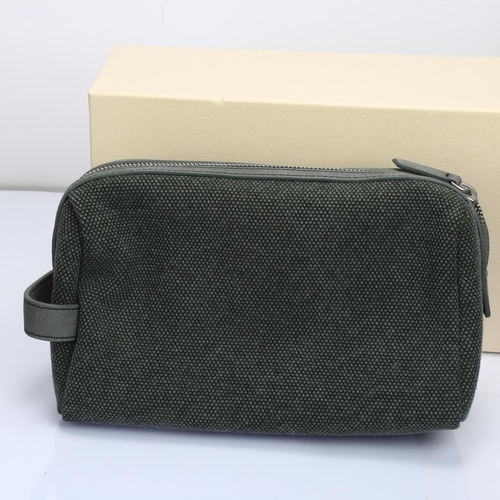 1037 - ROLEX - a green leather and woven cotton toiletry/washbag, width 24cm, boxed