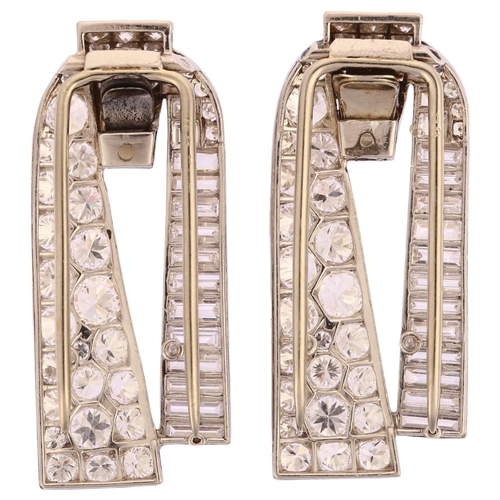 1103 - CARTIER - a pair of Art Deco platinum diamond dress clips, circa 1930s, geometric form, each set wit... 