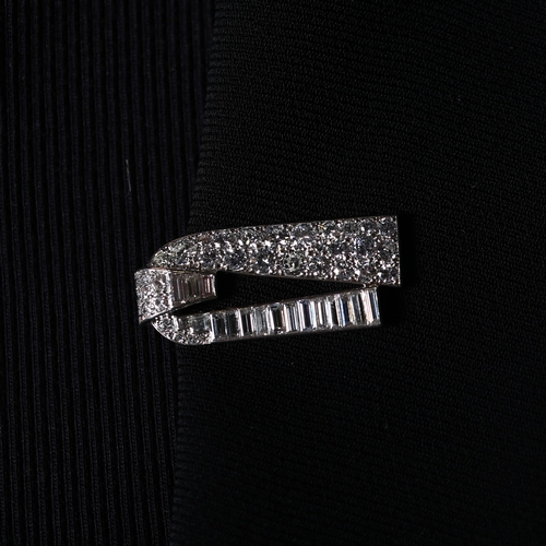 1103 - CARTIER - a pair of Art Deco platinum diamond dress clips, circa 1930s, geometric form, each set wit... 