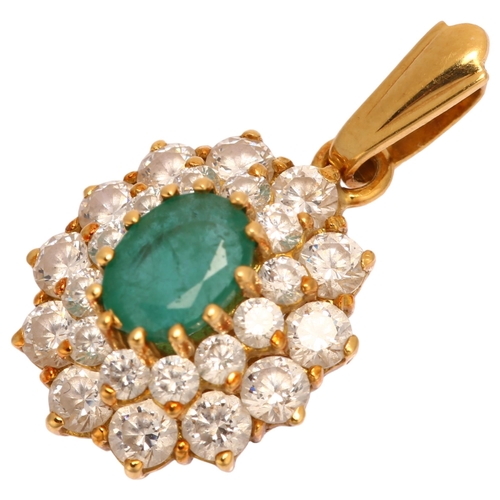 1107 - A modern 18ct gold emerald and diamond oval cluster drop pendant, maker's marks PAM, set with oval m... 