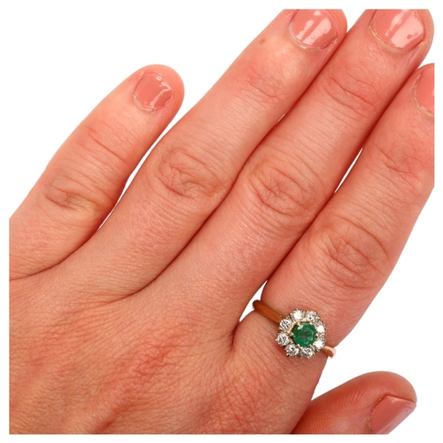 1108 - A late 20th century 18ct gold emerald and diamond flowerhead cluster ring, set with round-cut emeral... 