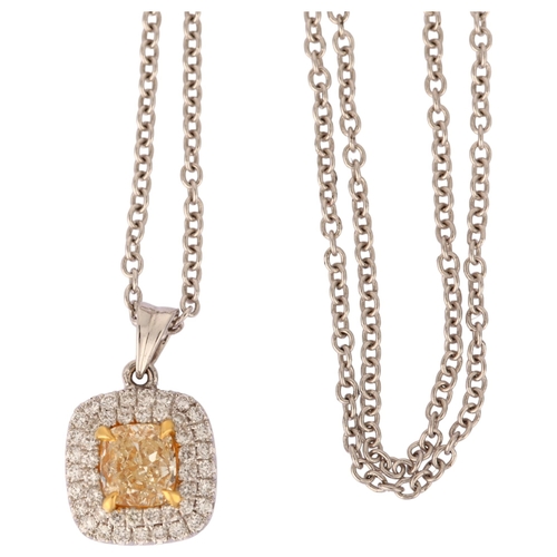 1110 - A fancy yellow diamond and diamond halo cluster pendant necklace, in 18ct white gold settings with c... 