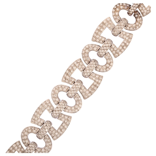 1120 - A modern 18ct white gold diamond panel bracelet, geometric design with square and oval panels, set w... 