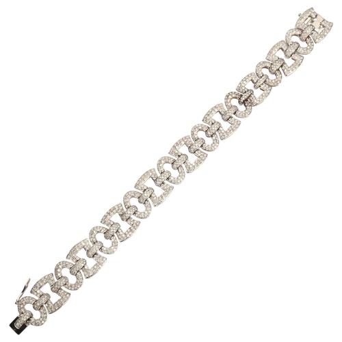 1120 - A modern 18ct white gold diamond panel bracelet, geometric design with square and oval panels, set w... 