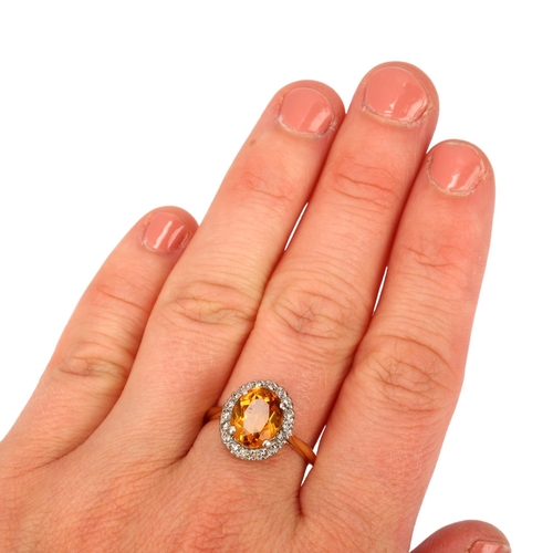 1131 - An 18ct gold citrine and diamond oval cluster ring, platinum-topped with oval mixed-cut citrine and ... 