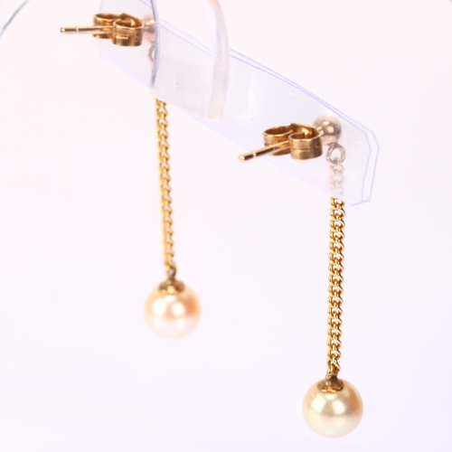 1133 - A pair of late 20th century 9ct gold pearl drop earrings, Birmingham 1988, set with 6.4mm pearls sus... 