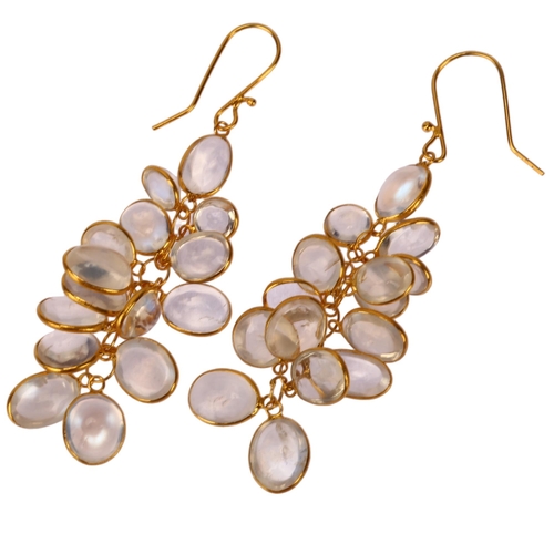 1137 - A pair of moonstone cluster drop earrings, unmarked 14ct gold settings with oval cabochon moonstones... 