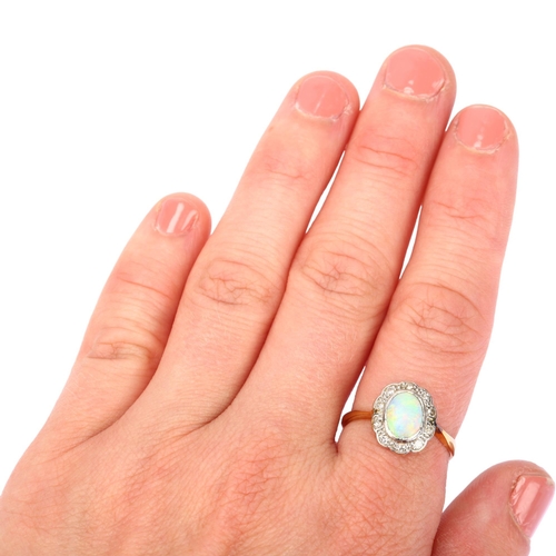 1140 - An 18ct gold opal and diamond oval cluster ring, set with oval cabochon opal and single-cut diamonds... 