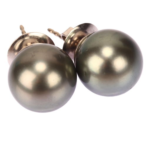 1145 - A pair of 18ct white gold whole black Tahitian pearl earrings, with stud fittings, pearl diameter 12... 