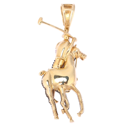 1150 - A large modern 9ct gold sapphire ruby and diamond 3-dimensional polo player pendant, pave set with r... 