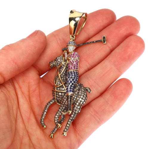 1150 - A large modern 9ct gold sapphire ruby and diamond 3-dimensional polo player pendant, pave set with r... 