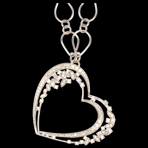 1153 - A large modern diamond openwork heart pendant necklace, unmarked 18ct white gold settings, with grad... 