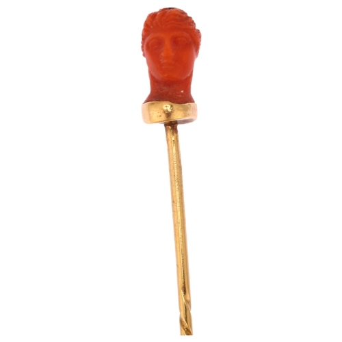 1160 - An Italian 19th century coral head stickpin, circa 1870, unmarked gold settings, head height 11.7mm,... 