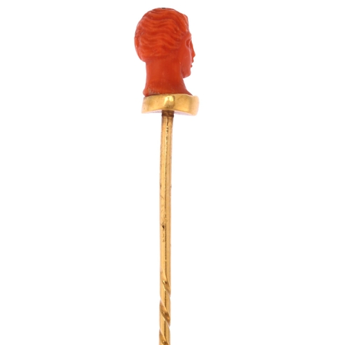 1160 - An Italian 19th century coral head stickpin, circa 1870, unmarked gold settings, head height 11.7mm,... 