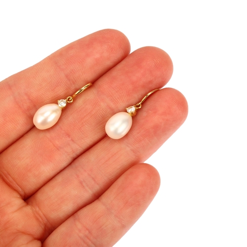 1161 - A pair of 18ct gold whole pearl and diamond drop earrings, with shepherd hook fittings, earring heig... 