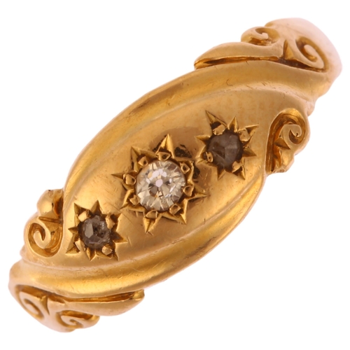 1164 - An early 20th century 18ct gold graduated three stone diamond gypsy ring, set with old and rose-cut ... 